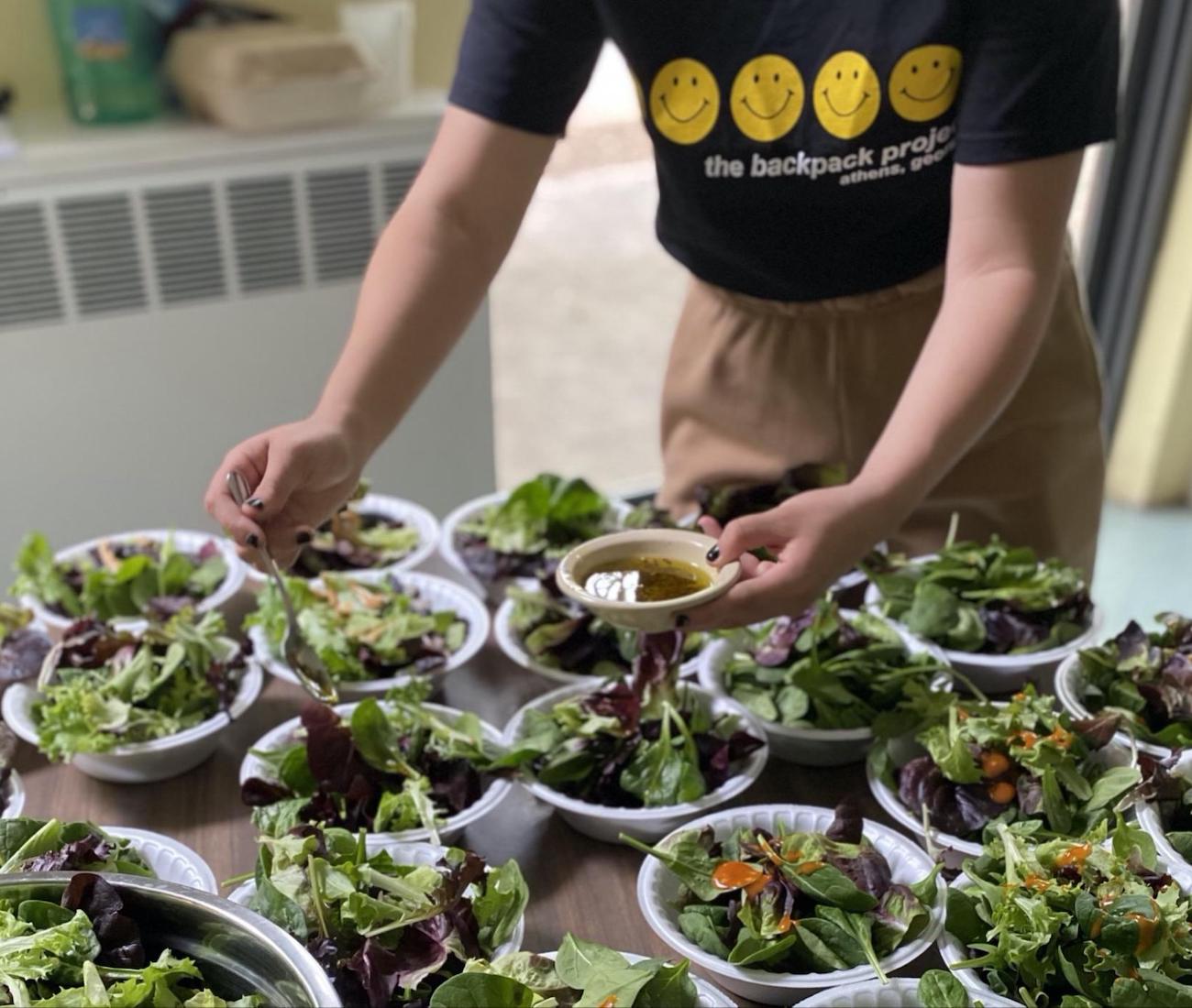 Making salads at Saturday Meals